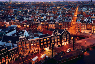 Aerial view of Amsterdam at night (� Rob Harpenau | iStockphoto.com)
