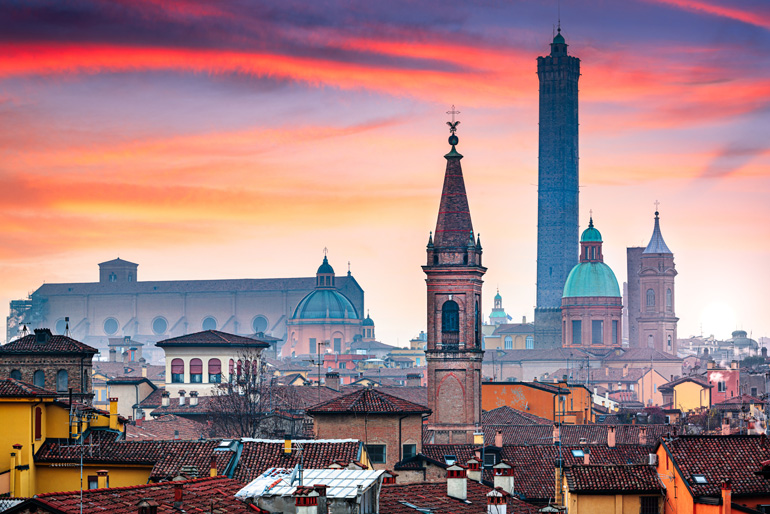 Bologna rooftop skyline and famous historic towers at dusk (© Sean Pavone | Dreamstime.com)