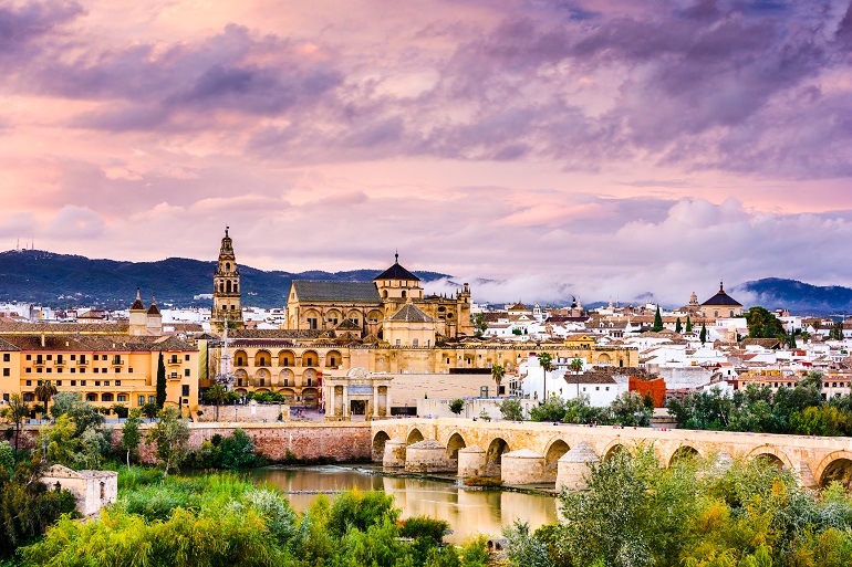 The Roman Bridge and Mosque-Cathedral on the Guadalquivir River, Cordoba (© Sean Pavone | Dreamstime.com)