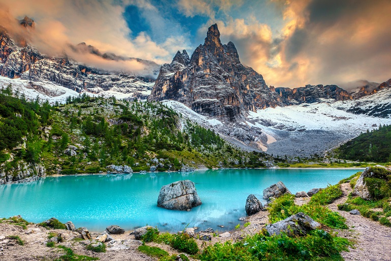 Lake Sorapis with high snowy mountains at sunset, Dolomites (© Janoka82 | Dreamstime.com)