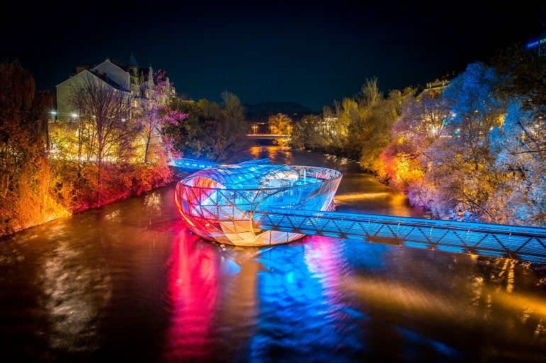 Murinsel illuminated at night, Graz (© minnystock | Dreamstime.com)