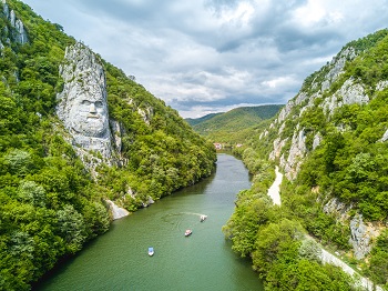 Head of Decebalus sculpted in rock at the Iron Gates, Romania (© Calin Stan | Dreamstime.com)