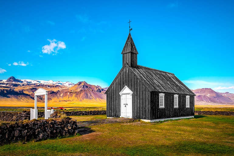 Old black church of Budir in the Snaefellsnes peninsula, Snæfellsjökull National Park (© Volodymyr Shevchuk | Dreamstime.com)