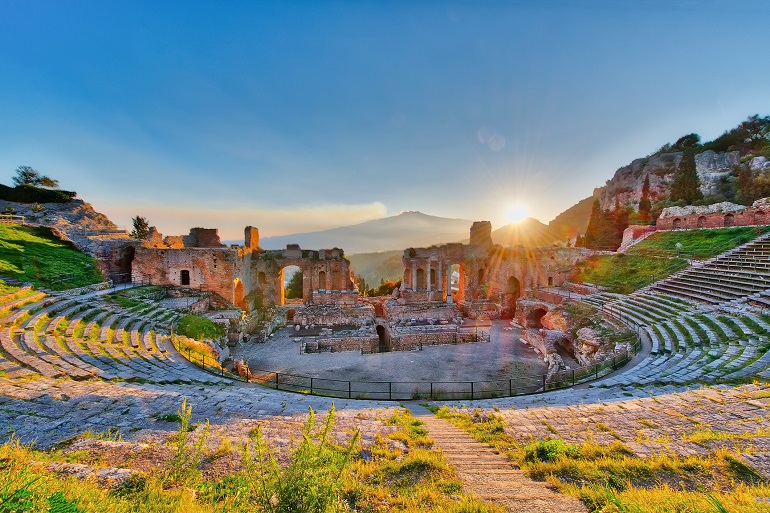 Ancient theatre of Taormina with Etna erupting volcano at sunset (© Michelangelo Oprandi | Dreamstime.com)