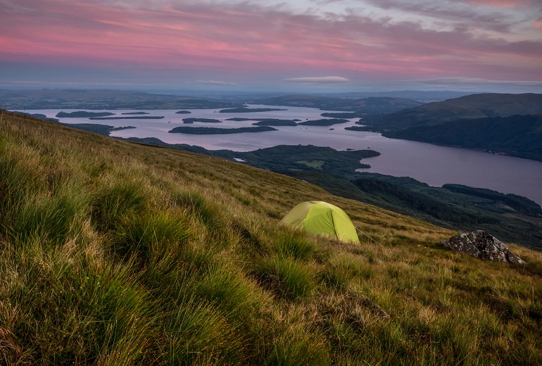 Green camping tent on Ben Lomond at dusk, Loch Lomond & Trossachs National Park (© Eduardo Ramos Morales | Dreamstime.com)