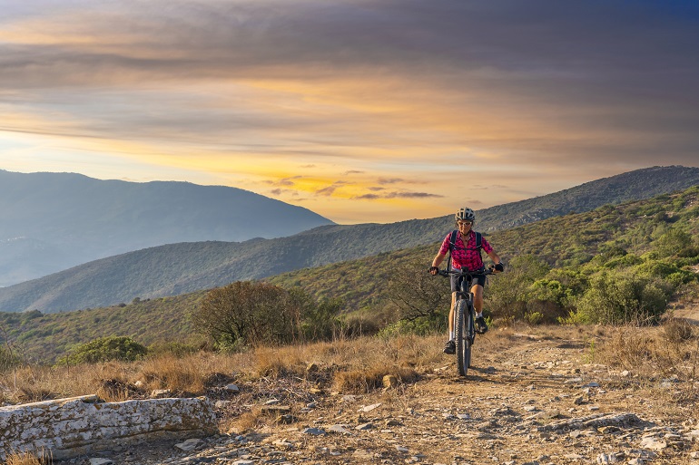 Woman on an e-bike on Elba Island, Tuscan Archipelago National Park (© Uwe Moser | Dreamstime.com)