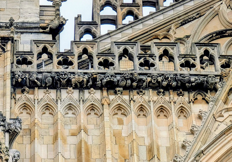 Grotesque faces on the façade of York Minster (&copy; Eupedia.com)